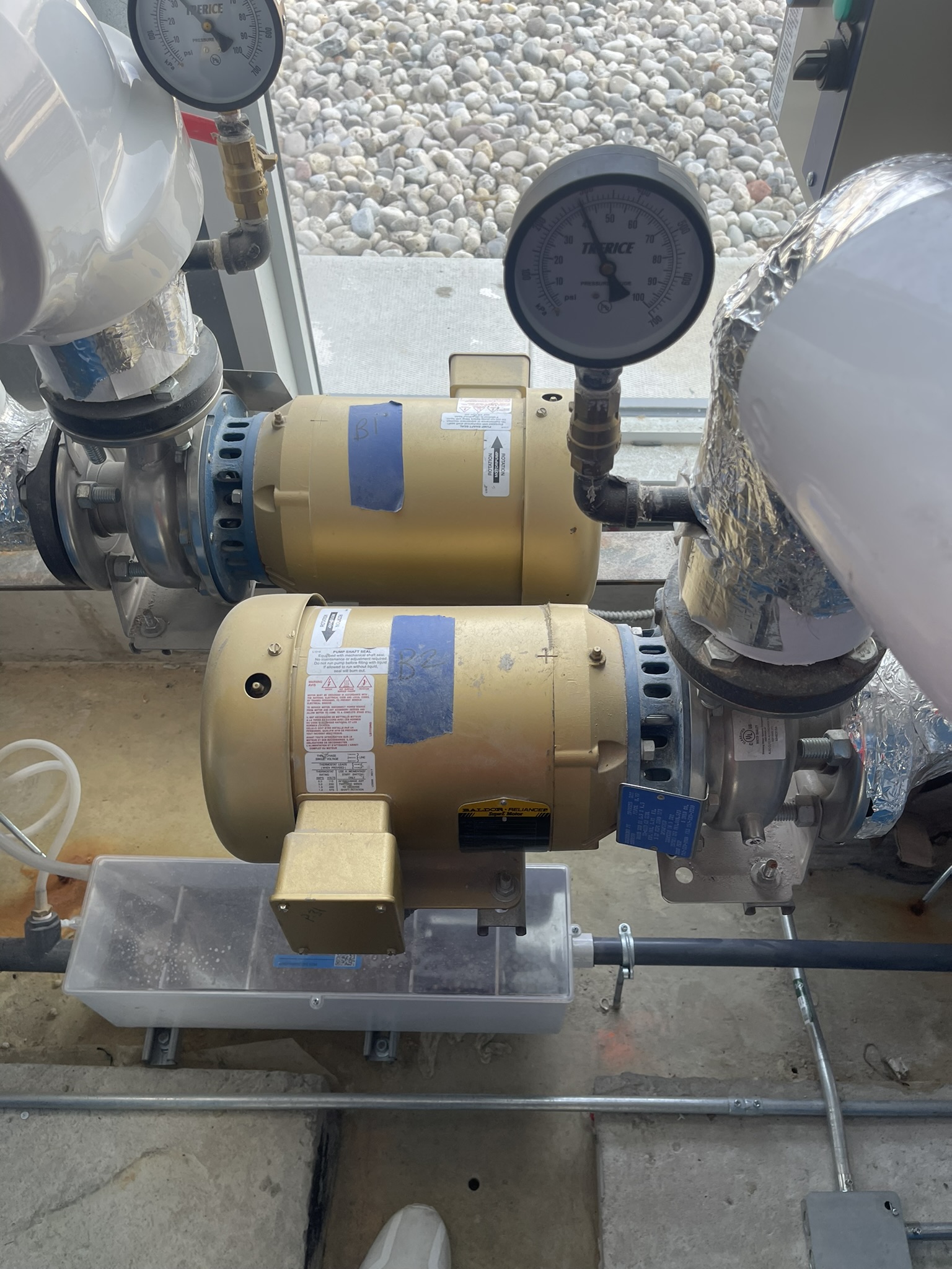 Twin gold motor pumps with pressure gauges